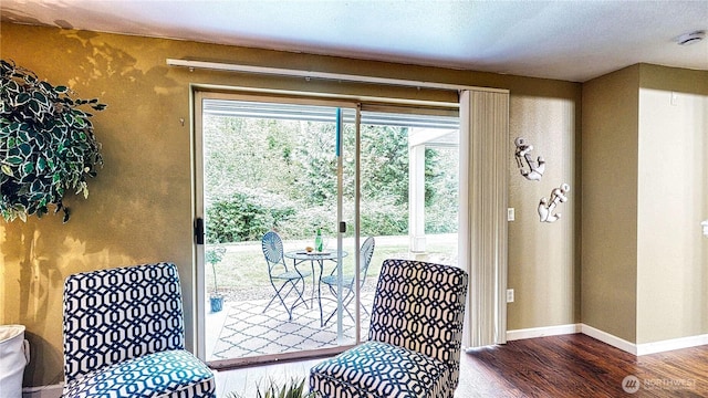 23301 Cedar Way Unit U102, Mountlake Terrace, WA 98043 - sitting room featuring wood finished floors and baseboards