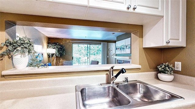 23301 Cedar Way Unit U102, Mountlake Terrace, WA 98043 - kitchen featuring white cabinets and light countertops