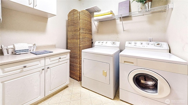23301 Cedar Way Unit U102, Mountlake Terrace, WA 98043 - washroom with cabinet space and washing machine and dryer