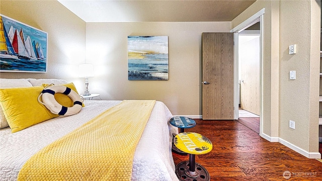 23301 Cedar Way Unit U102, Mountlake Terrace, WA 98043 - bedroom featuring wood finished floors and a textured wall