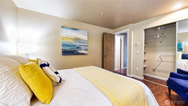 23301 Cedar Way Unit U102, Mountlake Terrace, WA 98043 - bedroom featuring wood finished floors and a closet