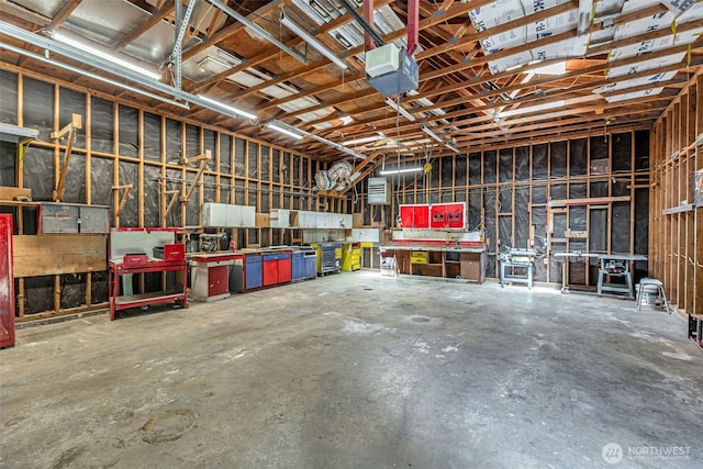 12124 SE 161st St, Renton, WA 98058 - garage with a workshop area and a garage door opener