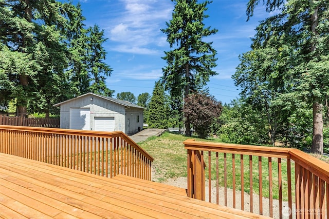 12124 SE 161st St, Renton, WA 98058 - deck featuring a detached garage, an outbuilding, and a lawn