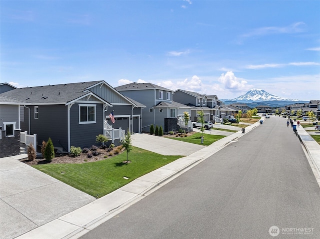 18231 132nd Ave E, Puyallup, WA 98374 - view of asphalt road featuring a residential view, a mountain view, curbs, and sidewalks