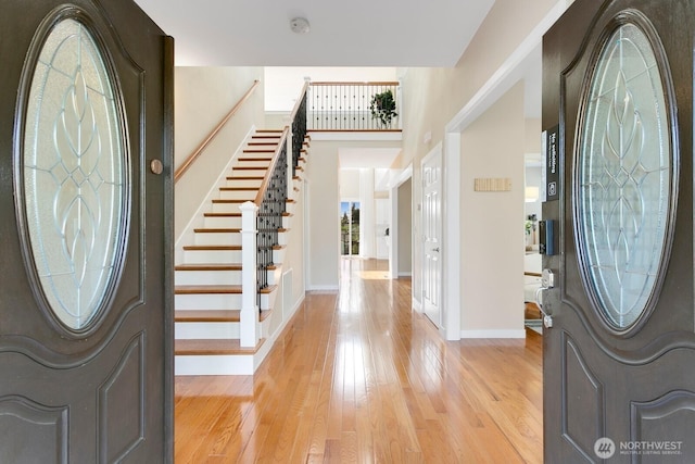 8441 8th Ave SW, Seattle, WA 98106 - foyer with stairs, light wood finished floors, and healthy amount of natural light