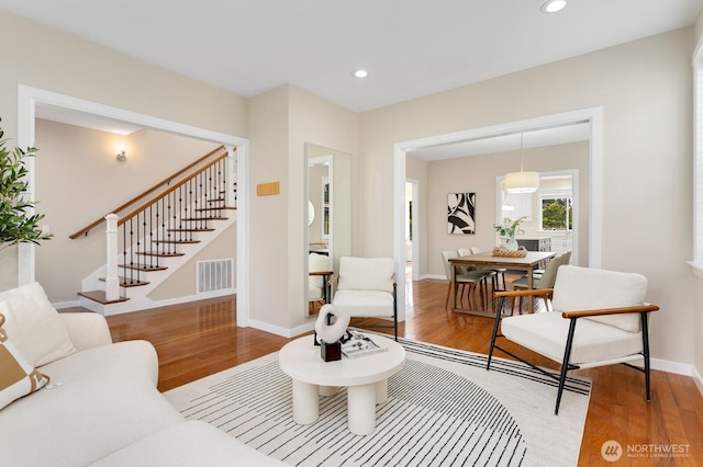 8441 8th Ave SW, Seattle, WA 98106 - living room with light wood finished floors, stairs, and recessed lighting