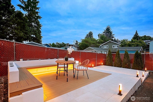 8441 8th Ave SW, Seattle, WA 98106 - wooden terrace with a fenced backyard, outdoor dining area, and a patio area