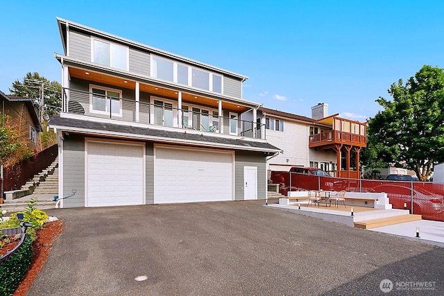 8441 8th Ave SW, Seattle, WA 98106 - townhome / multi-family property featuring a garage, a balcony, and driveway