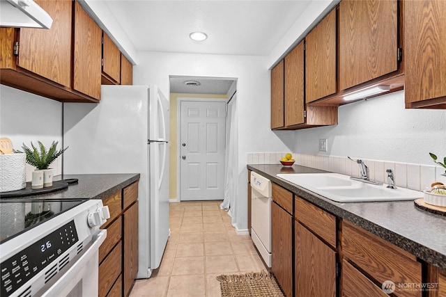 3100 Bill Mcdonald Pkwy Unit E101, Bellingham, WA 98225 - kitchen with electric range oven, dishwasher, dark countertops, and exhaust hood