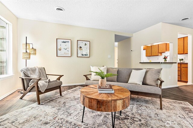 3100 Bill Mcdonald Pkwy Unit E101, Bellingham, WA 98225 - living area with wood finished floors and a textured ceiling