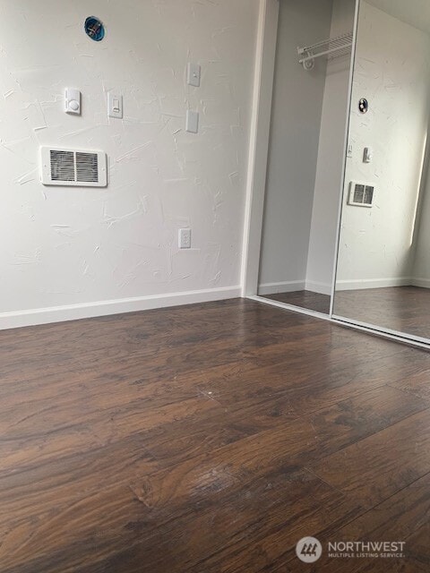 9928 Yakima Ave S, Tacoma, WA 98444 - laundry area featuring wood finished floors and baseboards