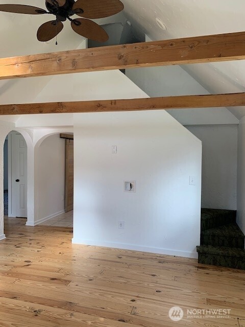 9928 Yakima Ave S, Tacoma, WA 98444 - spare room with arched walkways, light wood-type flooring, and a ceiling fan