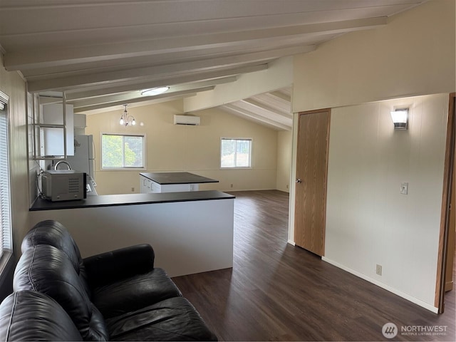 31 House Rd, Sequim, WA 98382 - living room with an AC wall unit and dark wood-style flooring