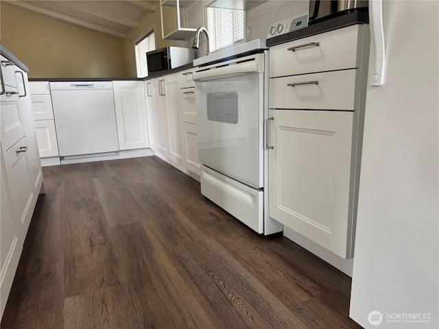 31 House Rd, Sequim, WA 98382 - kitchen with white appliances, dark wood-style floors, white cabinetry, and dark countertops