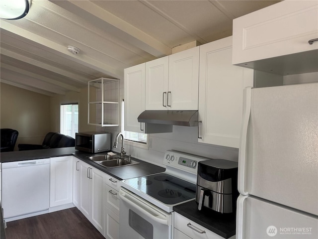 31 House Rd, Sequim, WA 98382 - kitchen with white appliances, under cabinet range hood, dark countertops, and white cabinets