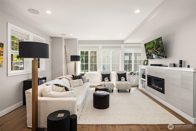 901 W Mcgraw St Unit 6, Seattle, WA 98119 - living area featuring a glass covered fireplace, wood finished floors, and recessed lighting