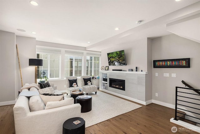 901 W Mcgraw St Unit 6, Seattle, WA 98119 - living area featuring a tile fireplace, wood finished floors, and recessed lighting