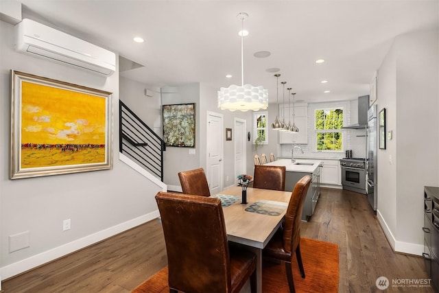 901 W Mcgraw St Unit 6, Seattle, WA 98119 - dining room featuring a wall mounted AC, dark wood-type flooring, recessed lighting, and a chandelier