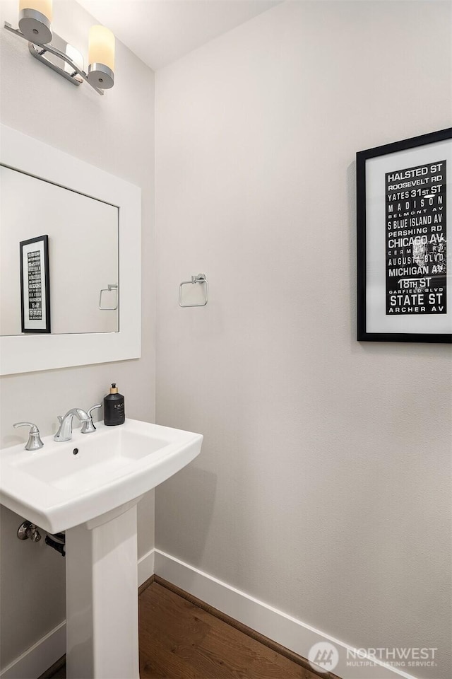 901 W Mcgraw St Unit 6, Seattle, WA 98119 - bathroom with baseboards and wood finished floors