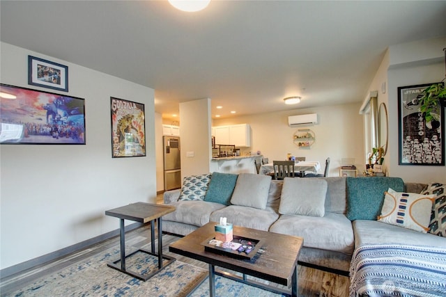 1651SW Mulberry St Unit E304, Oak Harbor, WA 98277 - living room featuring a wall mounted AC, wood finished floors, and recessed lighting