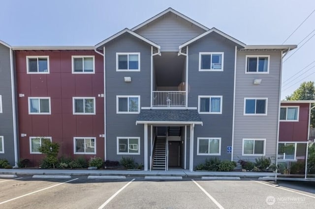 1651SW Mulberry St Unit E304, Oak Harbor, WA 98277 - view of property featuring uncovered parking