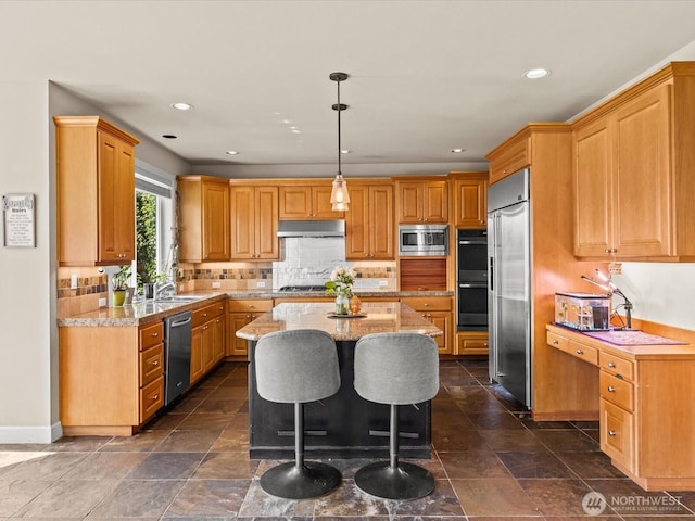 2135 204th Pl NE, Sammamish, WA 98074 - kitchen featuring built in appliances, a kitchen island, under cabinet range hood, tasteful backsplash, and light stone countertops