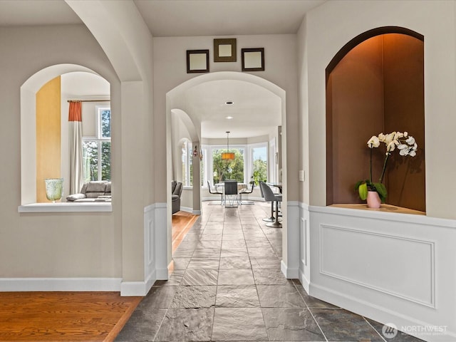 2135 204th Pl NE, Sammamish, WA 98074 - hallway featuring marble finish flooring and arched walkways