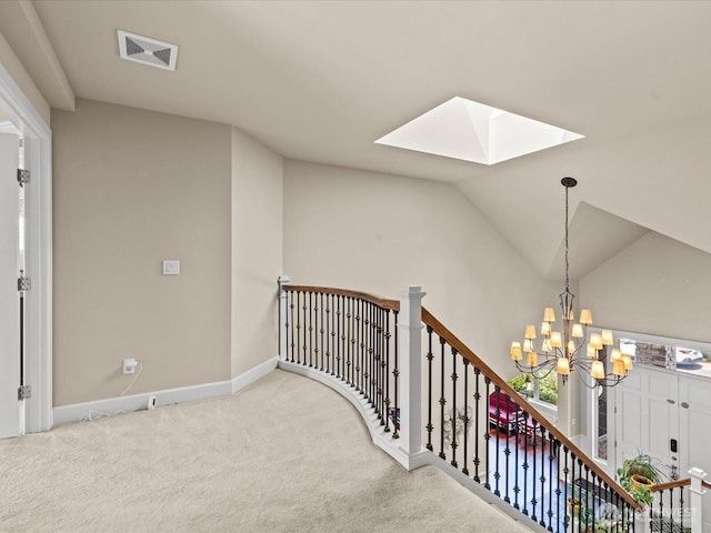 2135 204th Pl NE, Sammamish, WA 98074 - stairs featuring a skylight, carpet floors, a chandelier, and lofted ceiling