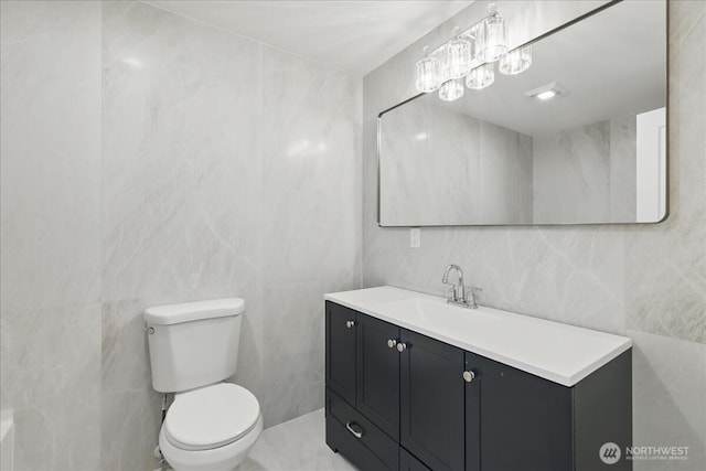 40 E Robert Pl, Sequim, WA 98382 - bathroom featuring tile walls and vanity