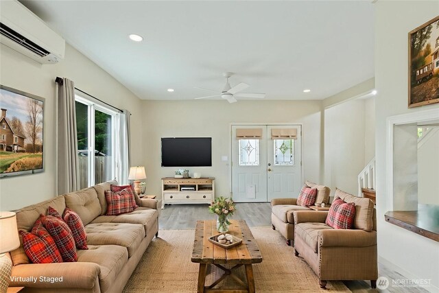27902 69th Ave NW, Stanwood, WA 98292 - living room featuring an AC wall unit, plenty of natural light, wood finished floors, ceiling fan, and recessed lighting