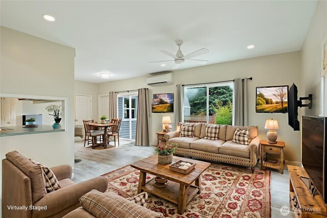 27902 69th Ave NW, Stanwood, WA 98292 - living area featuring a wall mounted air conditioner, light wood-style floors, ceiling fan, and recessed lighting