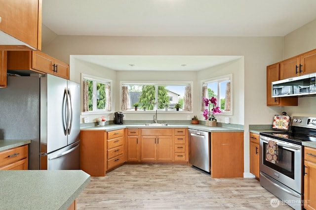 27902 69th Ave NW, Stanwood, WA 98292 - kitchen with appliances with stainless steel finishes, light wood-type flooring, and light countertops