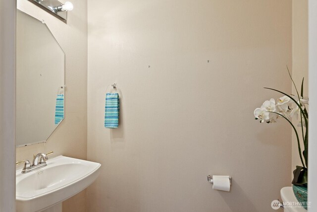27902 69th Ave NW, Stanwood, WA 98292 - half bathroom featuring a sink and toilet