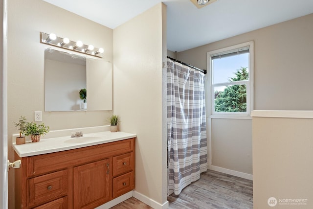 27902 69th Ave NW, Stanwood, WA 98292 - full bathroom featuring vanity, wood finished floors, and a shower with curtain