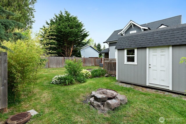 27902 69th Ave NW, Stanwood, WA 98292 - view of yard with a fire pit and a shed
