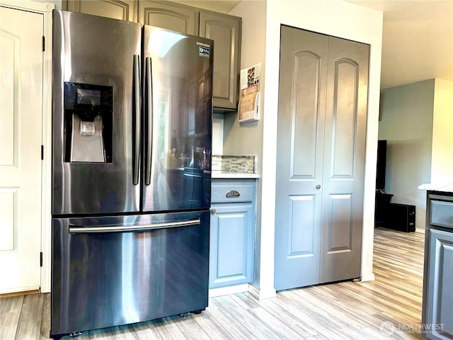 4313 131st St SE, Everett, WA 98208 - kitchen featuring stainless steel fridge with ice dispenser, light wood-style flooring, light countertops, and gray cabinets