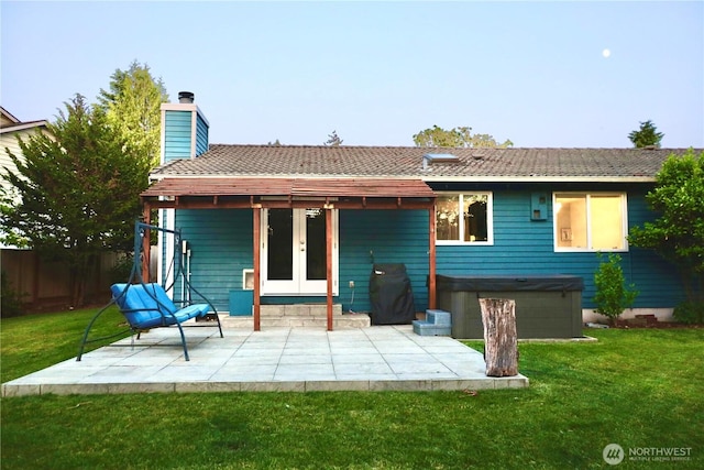 4313 131st St SE, Everett, WA 98208 - back of property with a hot tub, a patio, french doors, and a chimney