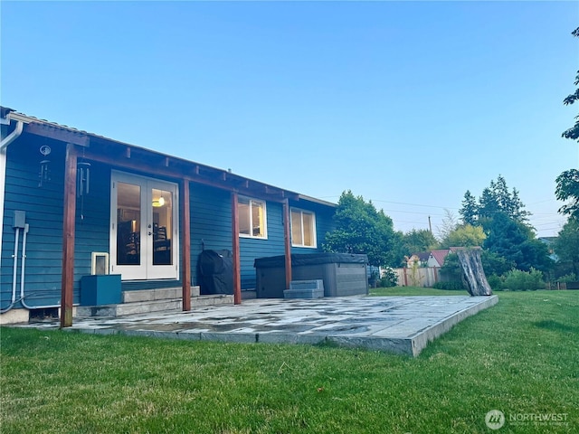 4313 131st St SE, Everett, WA 98208 - rear view of house featuring french doors, a hot tub, and a patio