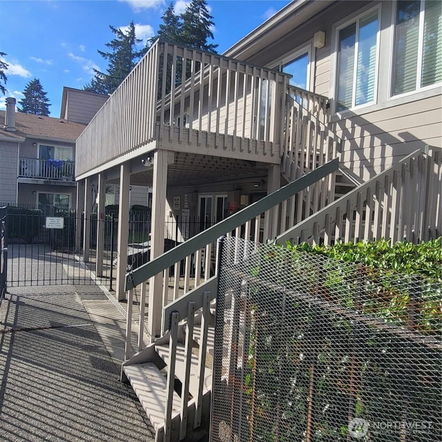 33010 17th Pl S Unit A-108, Federal Way, WA 98003 - view of side of home featuring stairs and a wooden deck