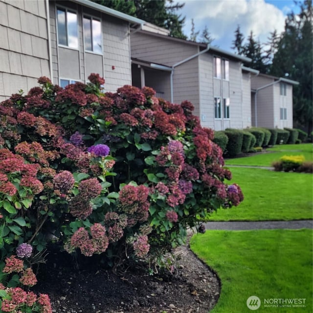 33010 17th Pl S Unit A-108, Federal Way, WA 98003 - view of side of home featuring a lawn