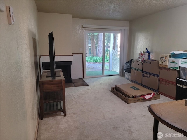 33010 17th Pl S Unit A-108, Federal Way, WA 98003 - carpeted living room featuring a textured wall and a textured ceiling