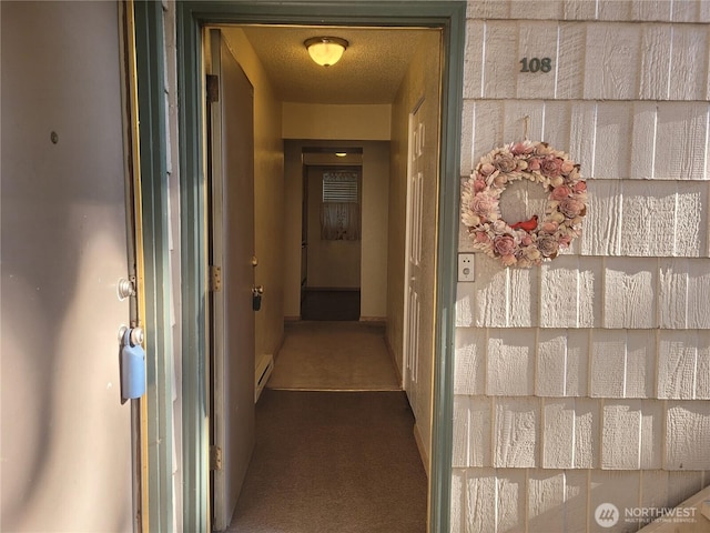 33010 17th Pl S Unit A-108, Federal Way, WA 98003 - hall featuring a baseboard heating unit and dark carpet