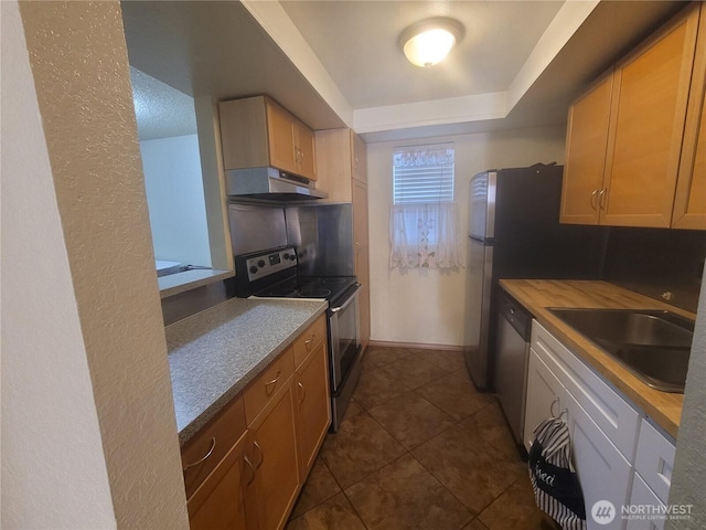 33010 17th Pl S Unit A-108, Federal Way, WA 98003 - kitchen with under cabinet range hood, appliances with stainless steel finishes, and dark tile patterned floors