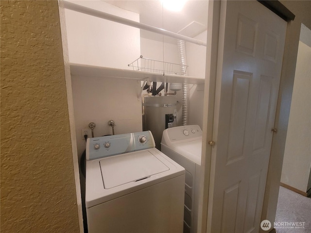 33010 17th Pl S Unit A-108, Federal Way, WA 98003 - laundry room featuring a textured wall, washing machine and clothes dryer, and electric water heater