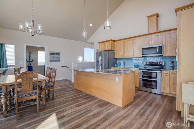 1511 E Ocean Shores Blvd SW, Ocean Shores, WA 98569 - kitchen with stainless steel appliances, light brown cabinets, dark wood-style flooring, a chandelier, and decorative backsplash