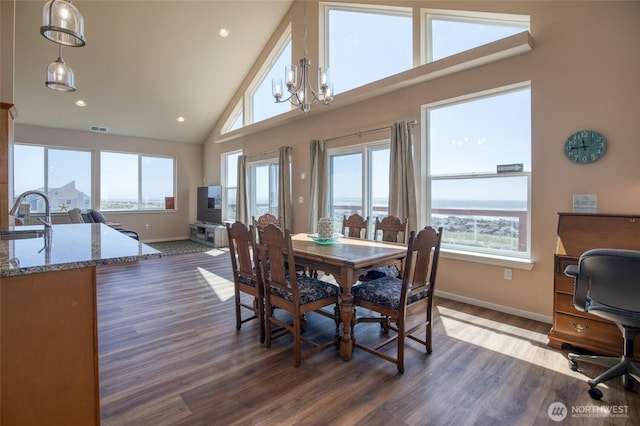 1511 E Ocean Shores Blvd SW, Ocean Shores, WA 98569 - dining room with high vaulted ceiling, dark wood-style flooring, a chandelier, and recessed lighting