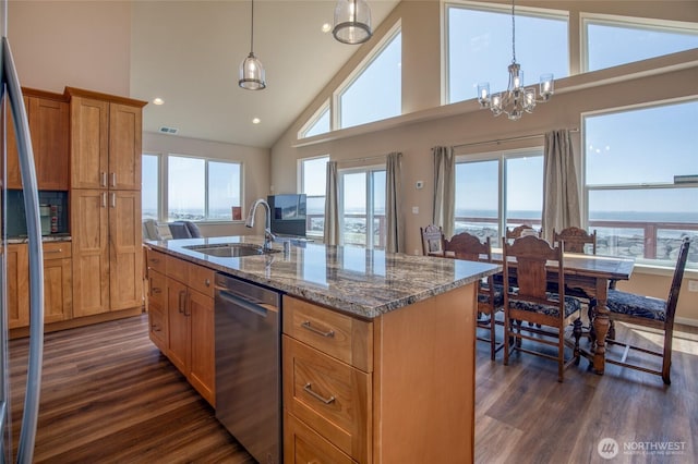 1511 E Ocean Shores Blvd SW, Ocean Shores, WA 98569 - kitchen with stainless steel dishwasher, dark wood-type flooring, high vaulted ceiling, stone counters, and a chandelier