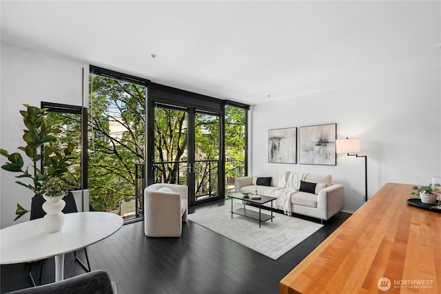 1111 E Pike St Unit 302, Seattle, WA 98122 - living area featuring wood finished floors and floor to ceiling windows