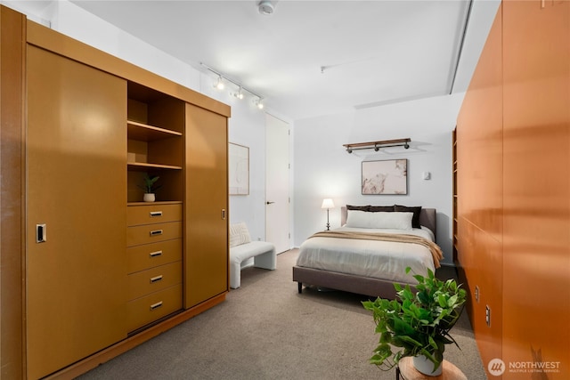 1111 E Pike St Unit 302, Seattle, WA 98122 - carpeted bedroom with rail lighting