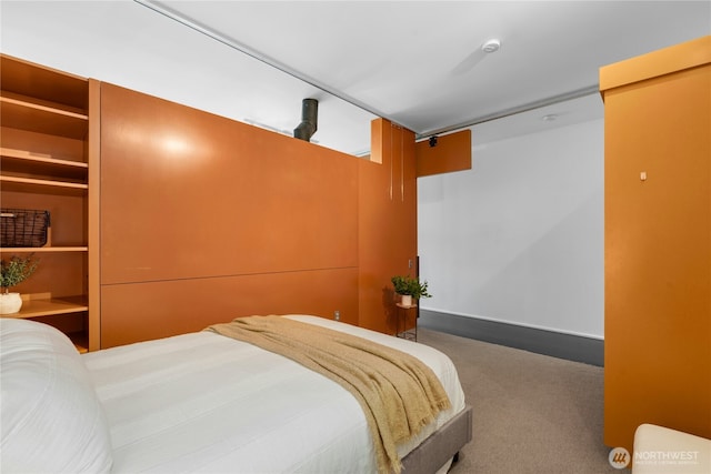 1111 E Pike St Unit 302, Seattle, WA 98122 - bedroom with carpet floors and baseboards